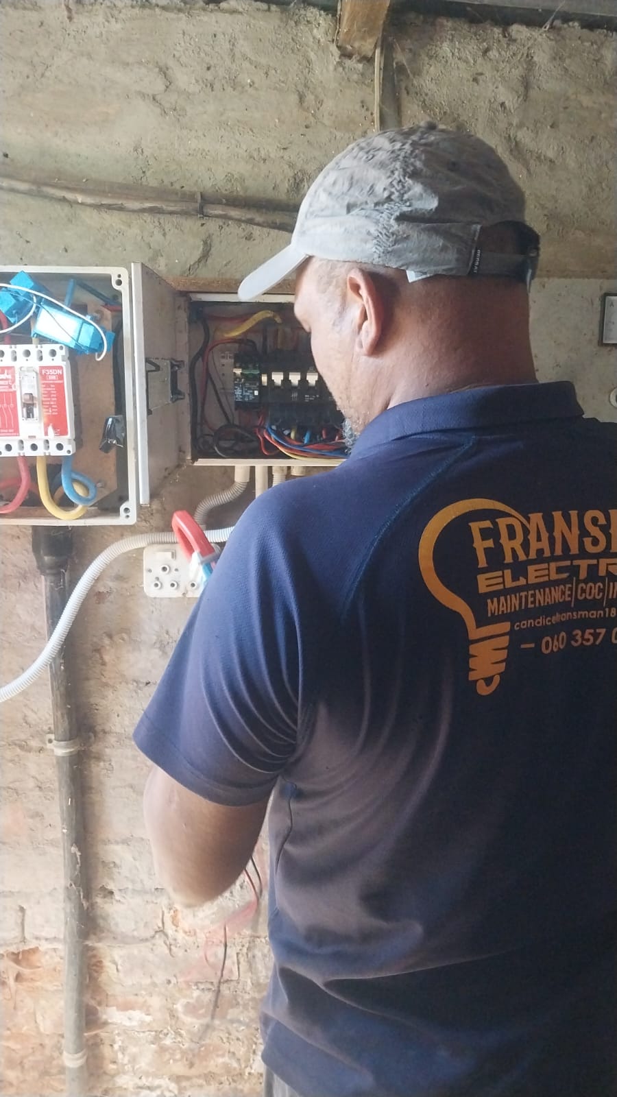 Professional electrician working with advanced equipment